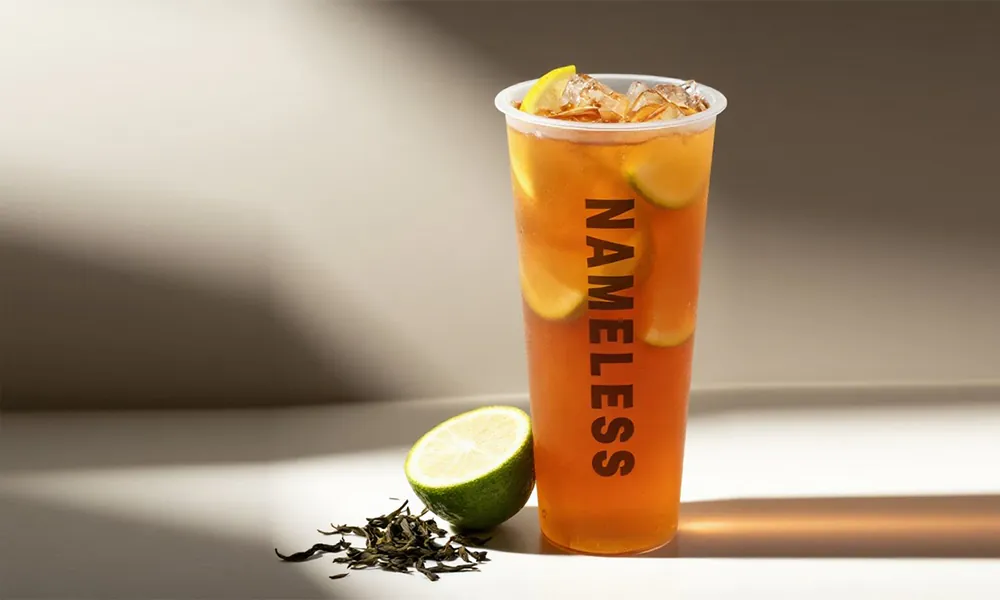 Refreshing iced oolong tea with lemon slices and tea leaves at Nameless Tea&Coffee, a Coffee Shop in Sacramento